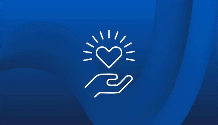 A graphic of a hand holding a heart logo against a blue background